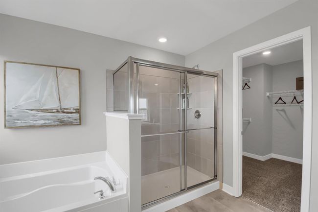 The large primary suite is an oasis and offers a private bath and two walk in closets. Model photos. Options and colors will vary. | Image 22