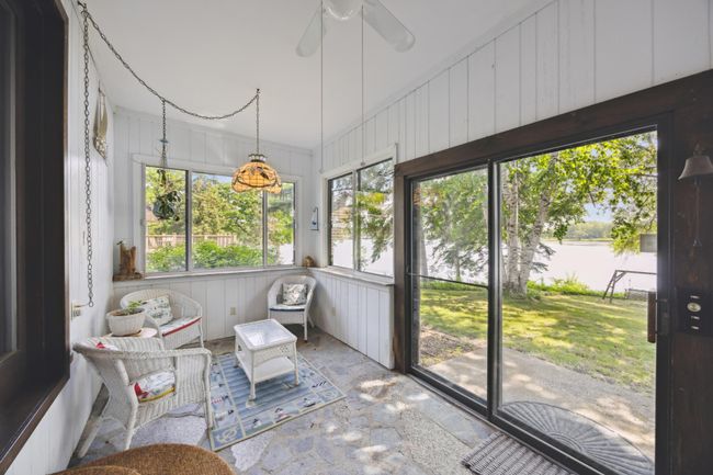 Four Season porch that overlooks the lake. | Image 8