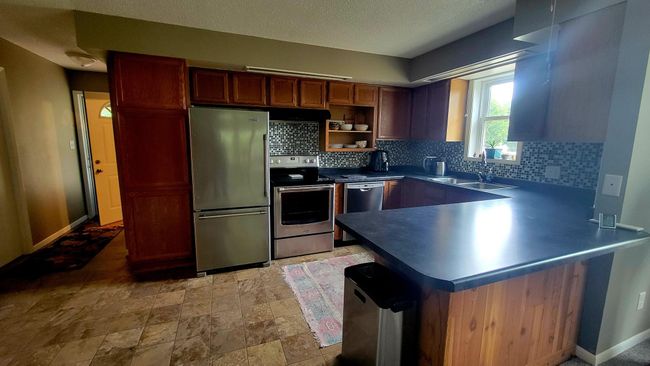 Large kitchen with bright natural light | Image 6