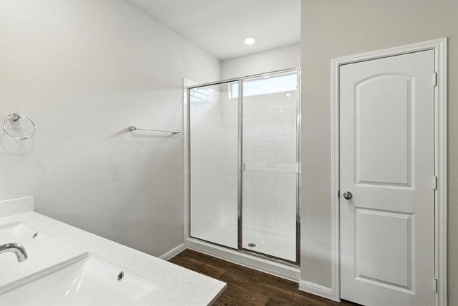 Full bath with a stall shower, wood finished floors, and vanity | Image 14