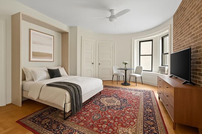 Virtually staged to show a Murphy bed option | Image 5