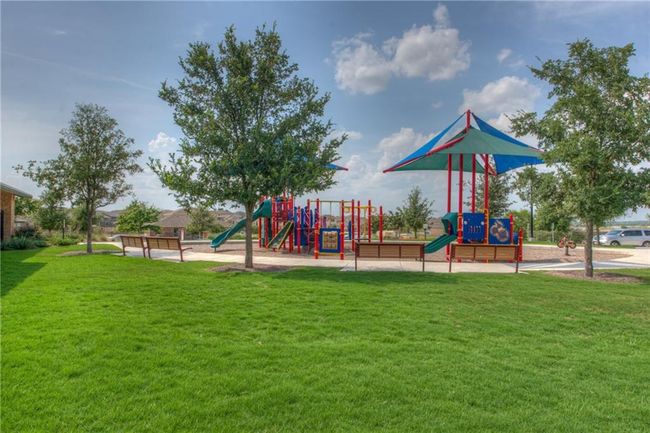 Community play area featuring a lawn | Image 11