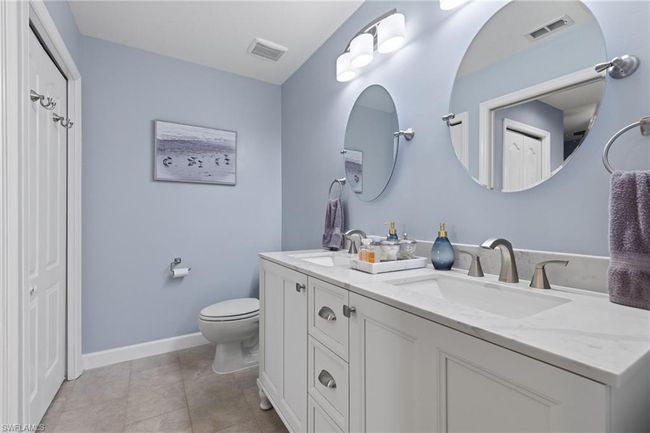 Bathroom featuring tile patterned floors, vanity, and toilet | Image 17