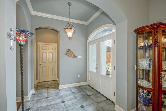 Porcelain tile flooring in the foyer | Image 7