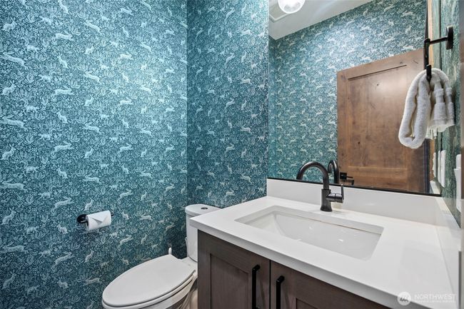 Adorable powder room for main floor convenience | Image 12