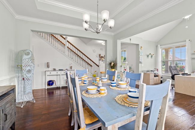 Dining area with hardwood / wood-style floors, stairs, a chandelier, ornamental molding, and an office area | Image 8