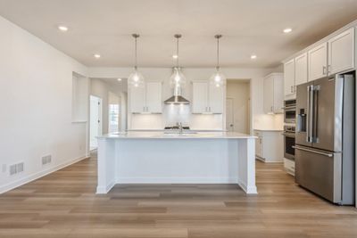 (Photo of similar home) The countertops have plenty of space to cook, entertain and more! | Image 1