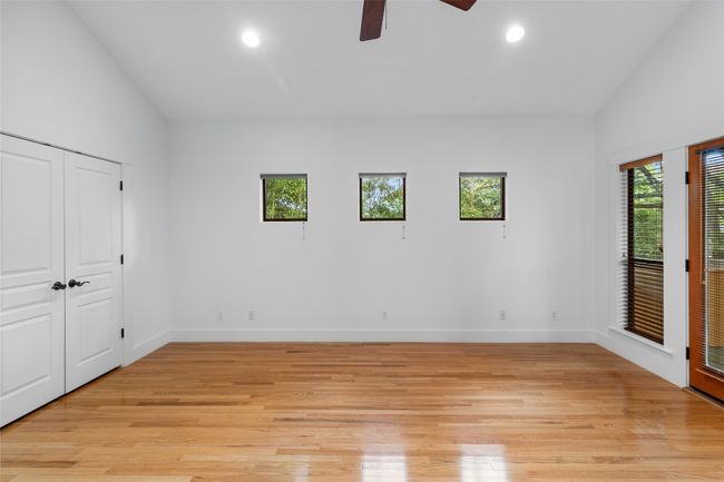 Unfurnished primary bedroom with recessed lighting and skylights. | Image 15