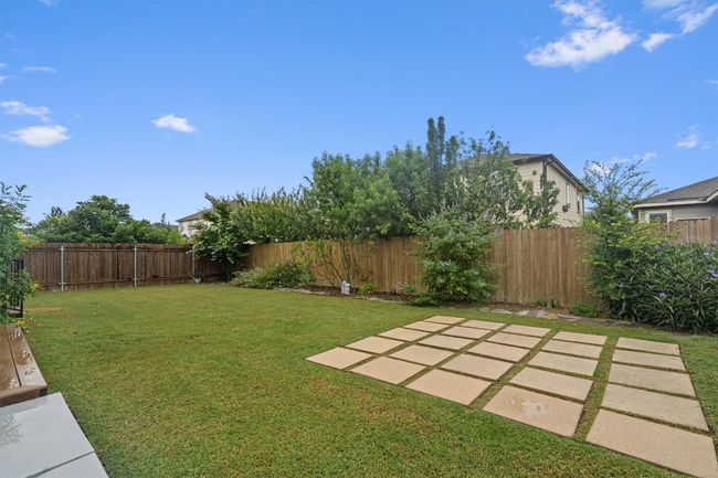 Fenced backyard featuring a patio area | Image 30