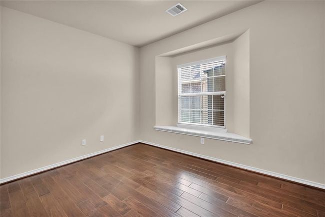 This versatile study can easily serve as a sixth bedroom, complete with access to a full bathroom. | Image 19