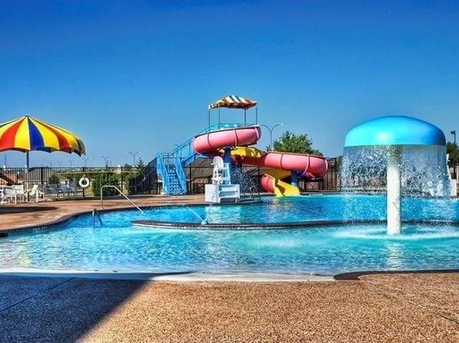 Community pool with a water slide | Image 18