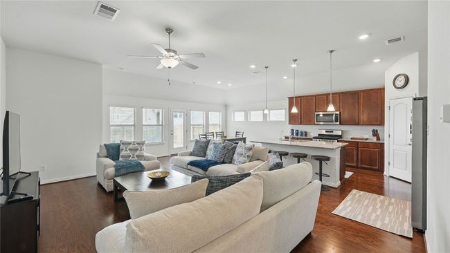 Living room featuring a ceiling fan, recessed lighting, and dark wood finished floors | Image 22