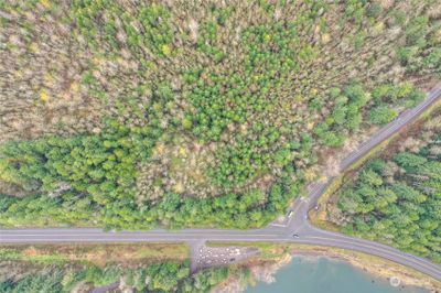 The cleared area shows a way to walk the slight slope to the top of the property, which was logged at some point. | Image 2