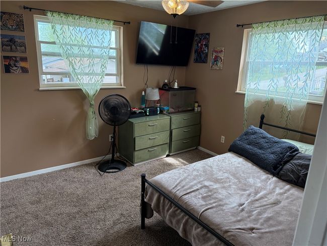 Bedroom with baseboards and carpet flooring | Image 12