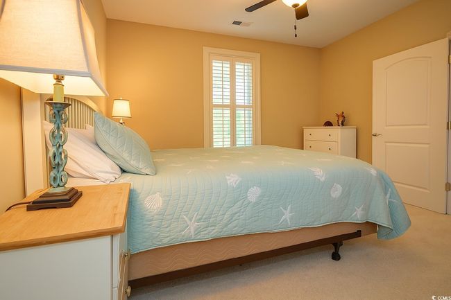 Bedroom featuring carpet floors and a ceiling fan | Image 21