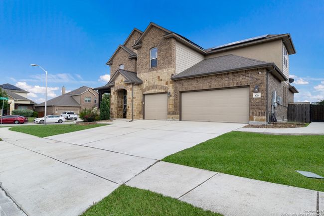 A stunning exterior shot of the home set against a | Image 37