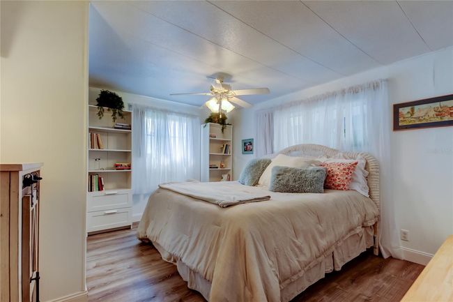 9. Bedroom #2 (11.6' x 13.2') Offers Standard Closet w Mirrored Sliders, Ceiling Fan, & Right Next to Guest Bathroom! . | Image 9