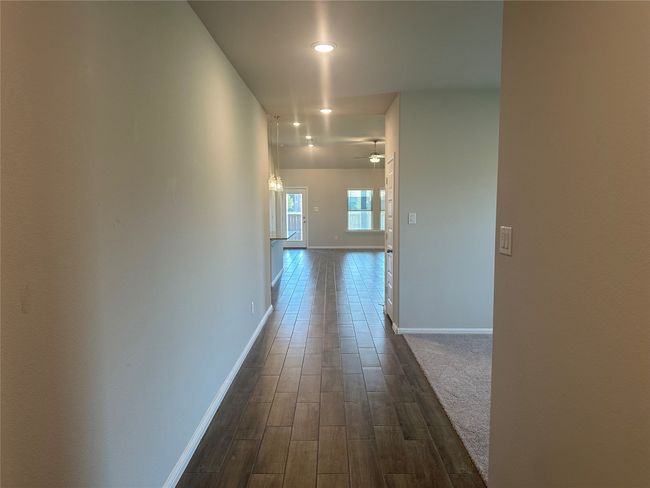 Entryway dark wood-type flooring and recessed lighting | Image 5