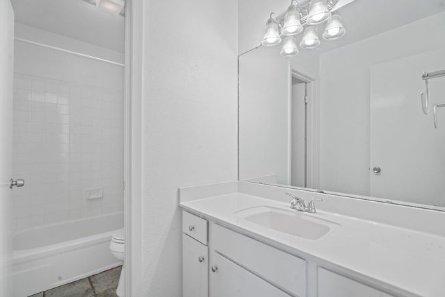 The full secondary bathroom also comes with a spacious vanity area and a separate water closet with the shower/tub combo. | Image 23