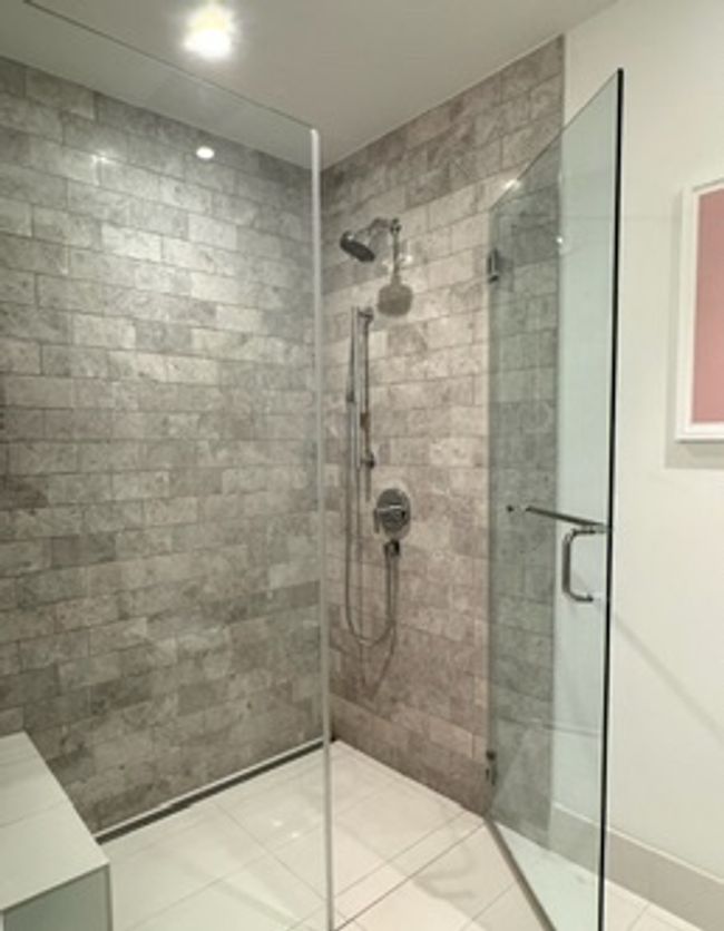 Bathroom featuring tiled shower, recessed lighting, and tile patterned floors | Image 16