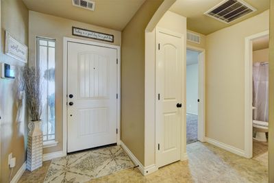 Foyer entrance featuring light tile patterned floors | Image 2