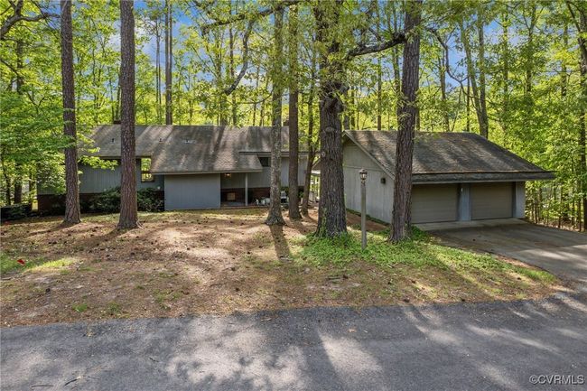 View of front of home featuring a detached garage | Image 47