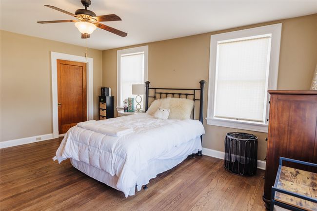 Bedroom with ceiling fan and dark hardwood / wood-style floors | Image 30
