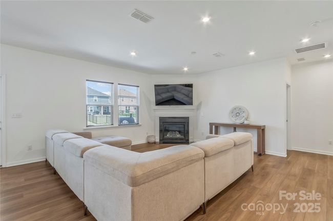Family room. Great for entertaining by the gas log fireplace. | Image 10