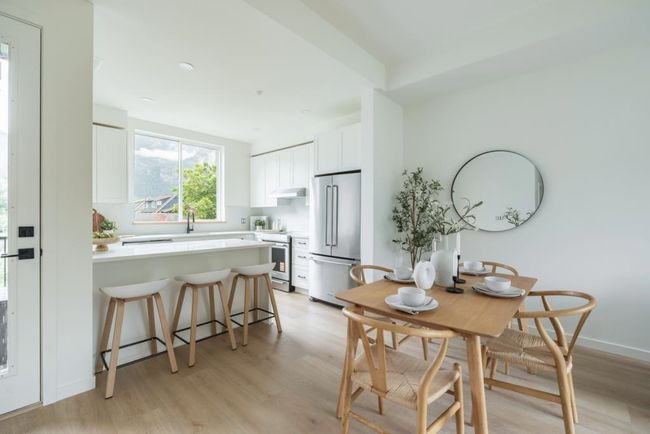 Dining room with light wood-type flooring | Image 8