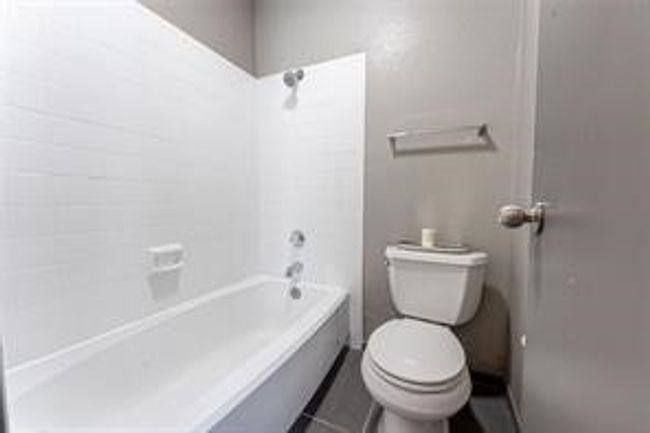 Bathroom with shower combination and tile patterned flooring | Image 22