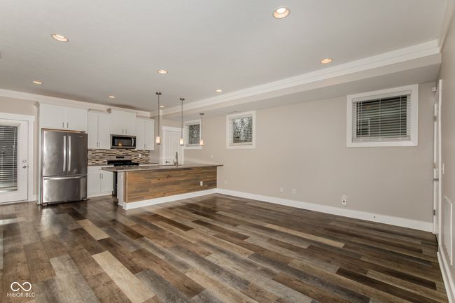 kitchen with stainless steel appliances, white cabinets, baseboards, dark wood-style floors, and recessed lighting | Image 19