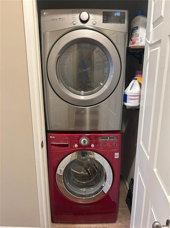 The sellers are leaving the full sized LG washer and dryer, this closet is behind the back door. | Image 24