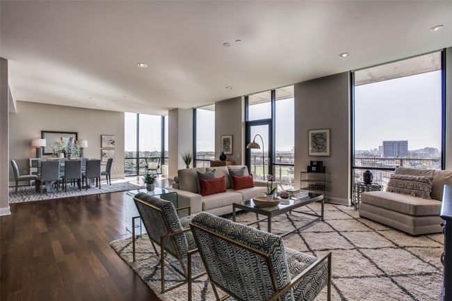 Living room looking towards expansive dining room & large balcony. | Image 6