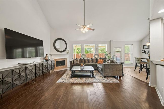 Soaring ceilings, wood flooring, and neutral finishes offer a warm and welcoming ambiance with plenty of space for relaxing or gathering with guests. | Image 15