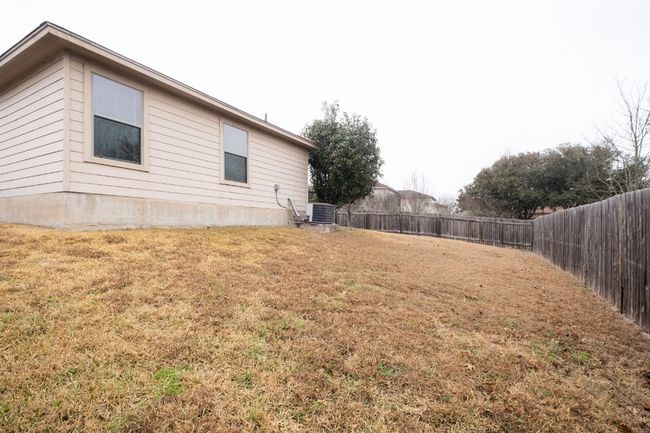 View of fenced backyard | Image 29