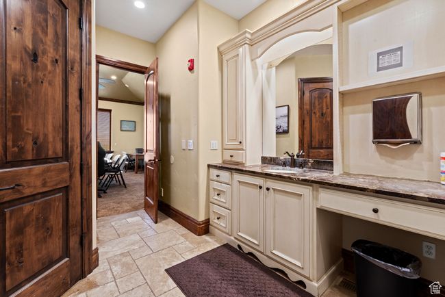 Bathroom with stone tile flooring, baseboards, recessed lighting, and vanity | Image 27