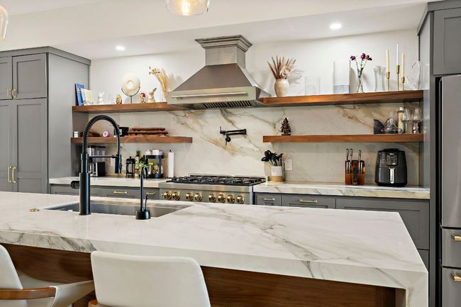 Bar with recessed lighting, backsplash, wall chimney range hood, a sink, and range | Image 10
