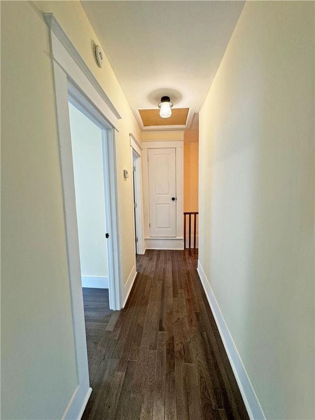 Hallway with dark hardwood / wood-style flooring | Image 10