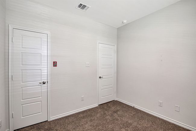 Empty room with dark carpet and baseboards | Image 23
