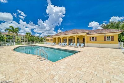 View of swimming pool with a patio area | Image 2