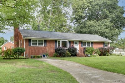 Ranch-style home featuring a front lawn | Image 1