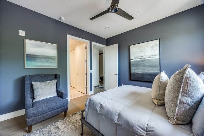 Bedroom featuring recessed lighting, wood finished floors, visible vents, a ceiling fan, and baseboards | Image 21