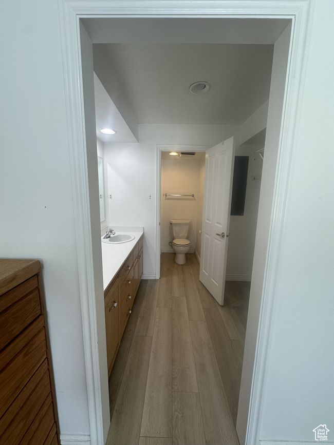 Bathroom with vanity and wood finished floors | Image 9