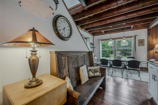 Sitting room with beamed ceiling and wood-type flooring | Image 5