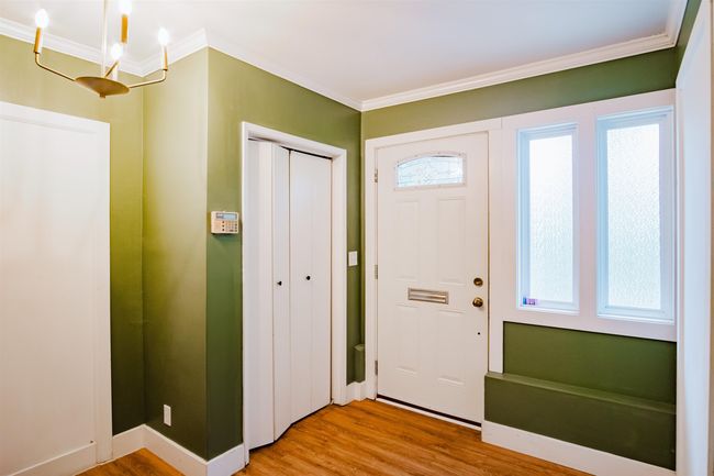 Entrance foyer featuring light wood-style flooring and crown molding | Image 4