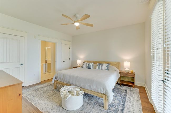 Bedroom with wood finished floors, ensuite bath, two closets, one walk in and the other for storage. | Image 13
