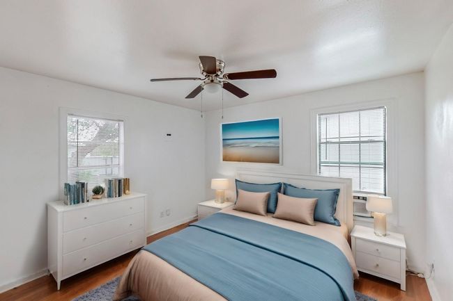 Bedroom featuring wood finished floors and a ceiling fan | Image 12