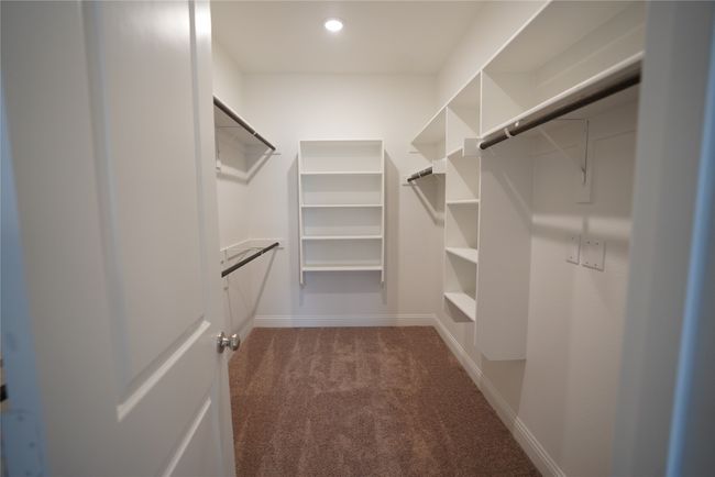 Spacious closet with carpet floors | Image 22