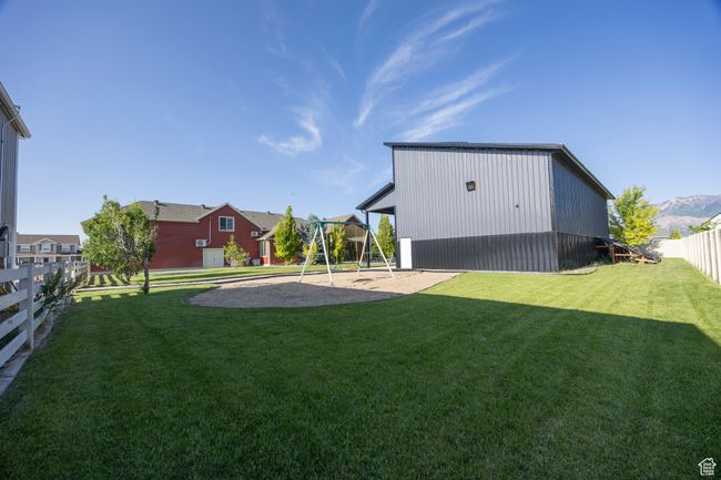 View of yard featuring a playground | Image 92