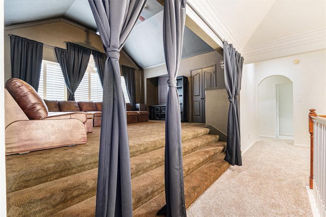 Just off the landing we stumble upon this AMAZING media room! You are just steps away from movie bliss! This room appears lighter in these pictures, but rest assured its movie ready! | Image 26